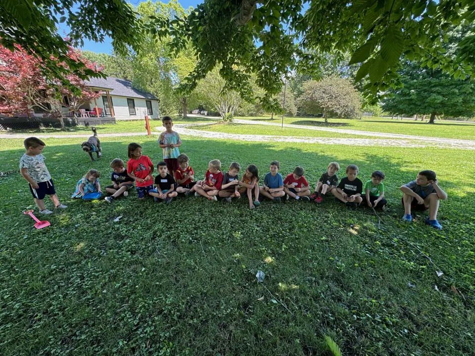 Campers sitting together on the lawn