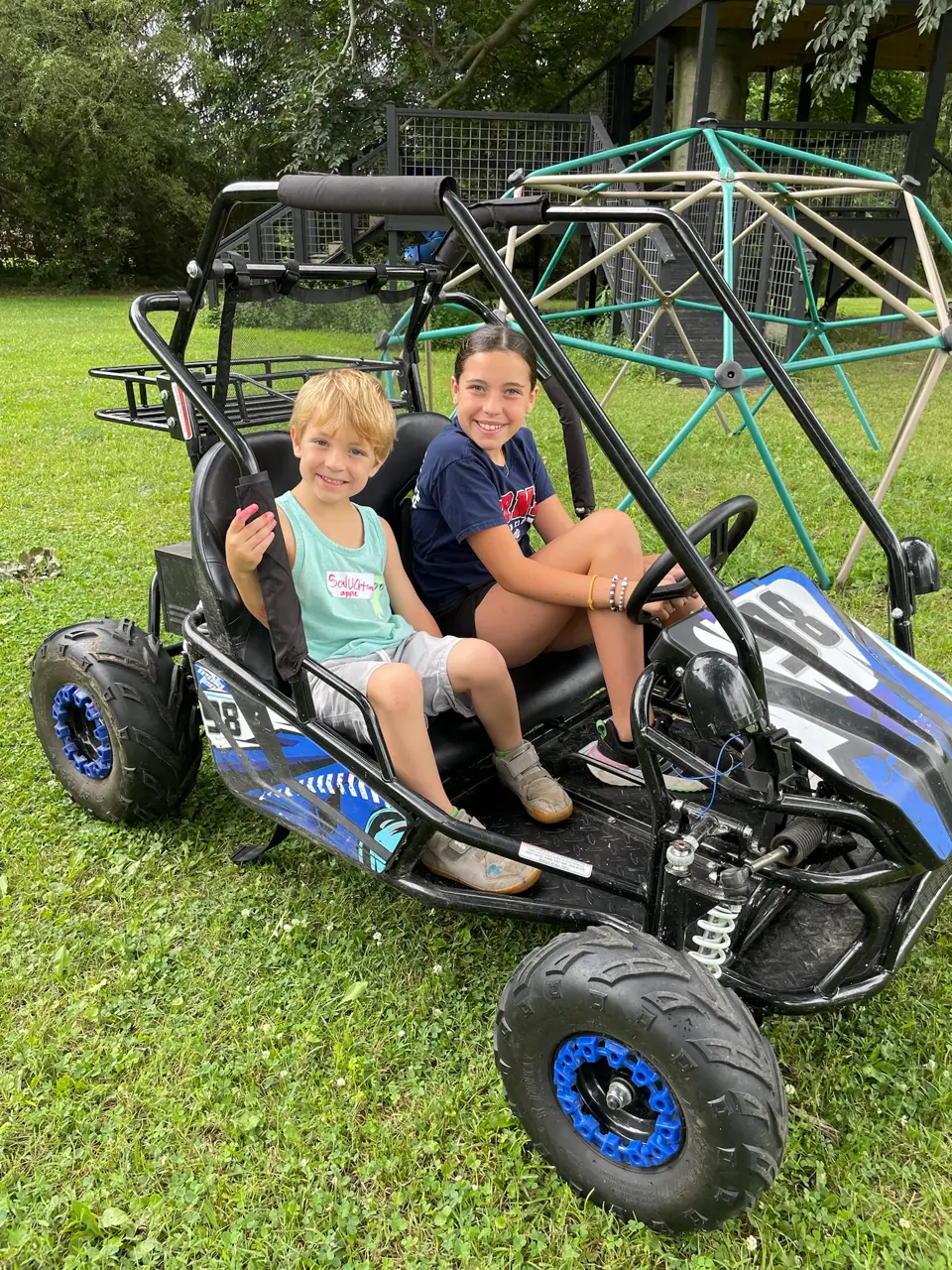 Kids riding in the farm gator